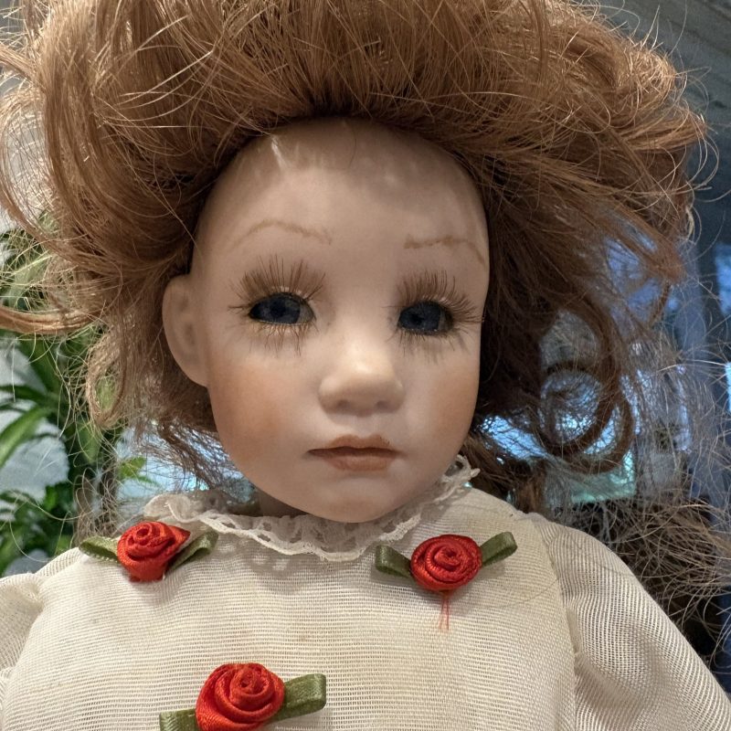Vintage Porcelain Doll with Red Hair and Floral Dress