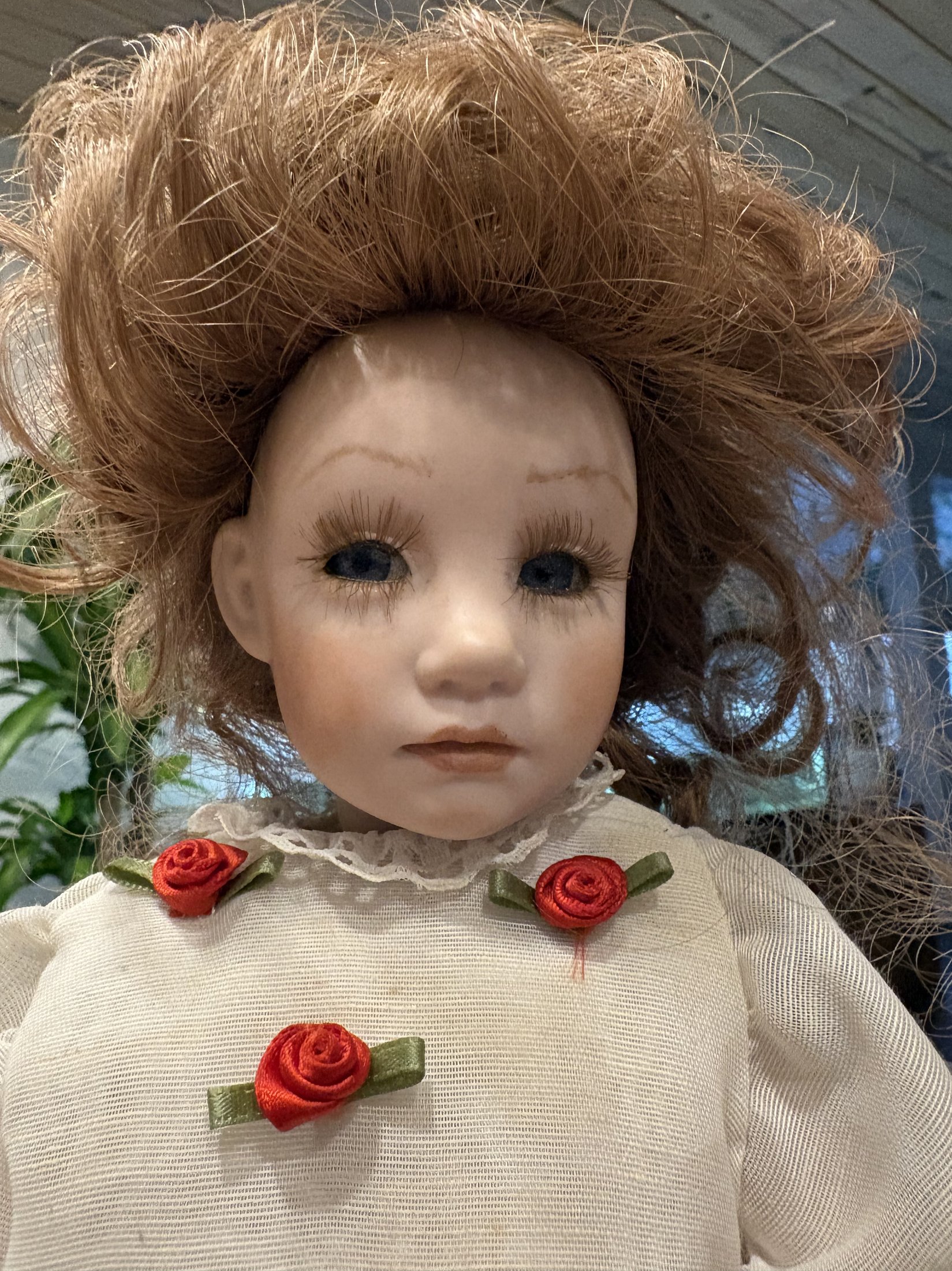 Vintage Porcelain Doll with Red Hair and Floral Dress