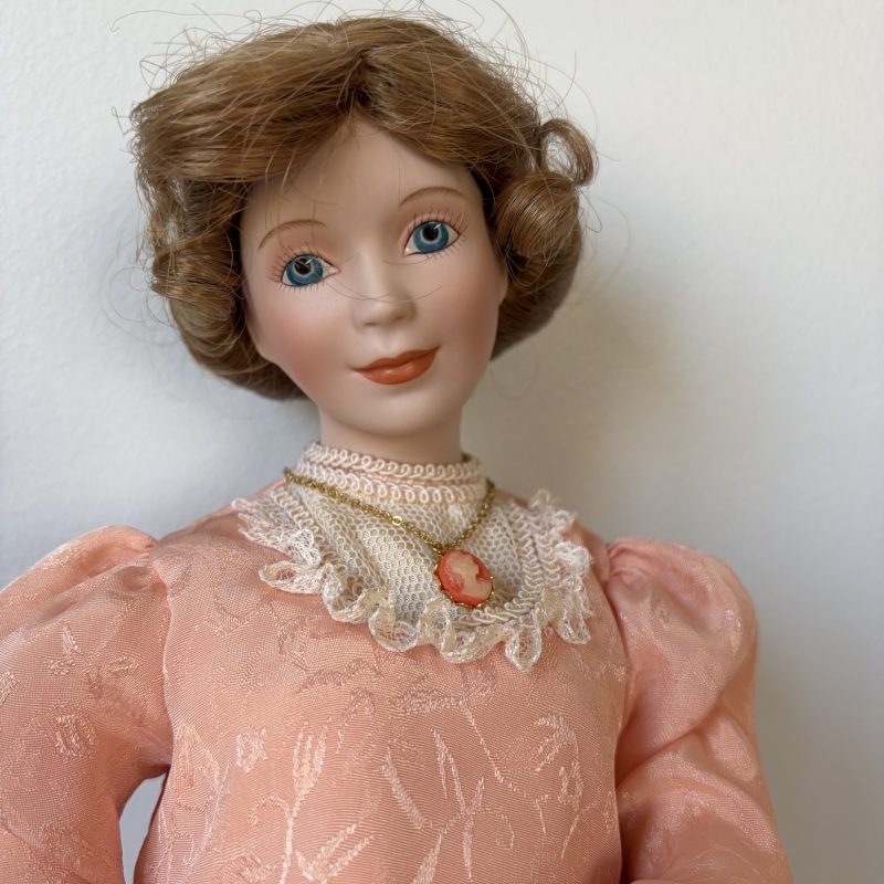 Porcelain Doll in Pink Lace Dress with Brown Hair and Blue Eyes