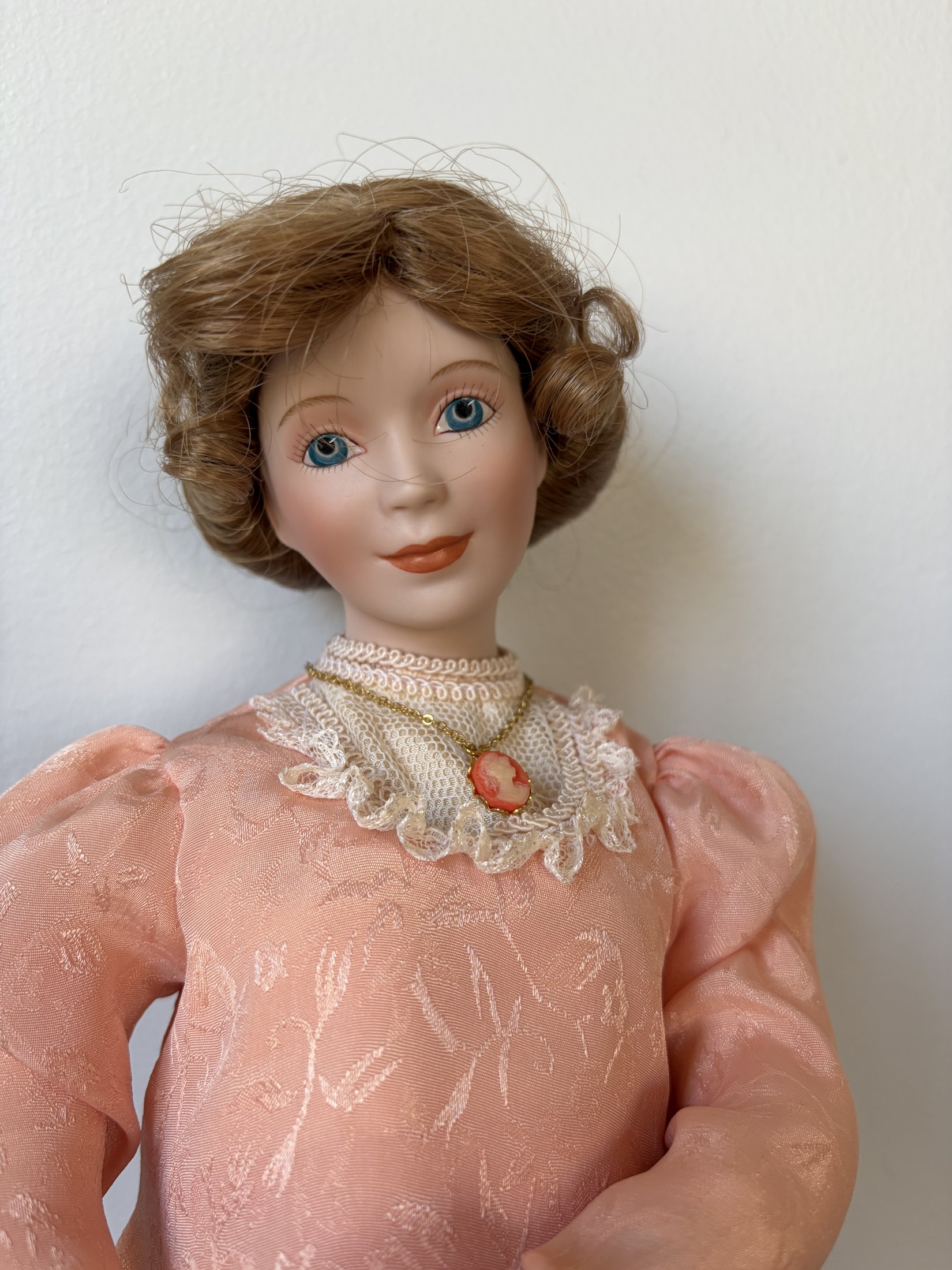Porcelain Doll in Pink Lace Dress with Brown Hair and Blue Eyes
