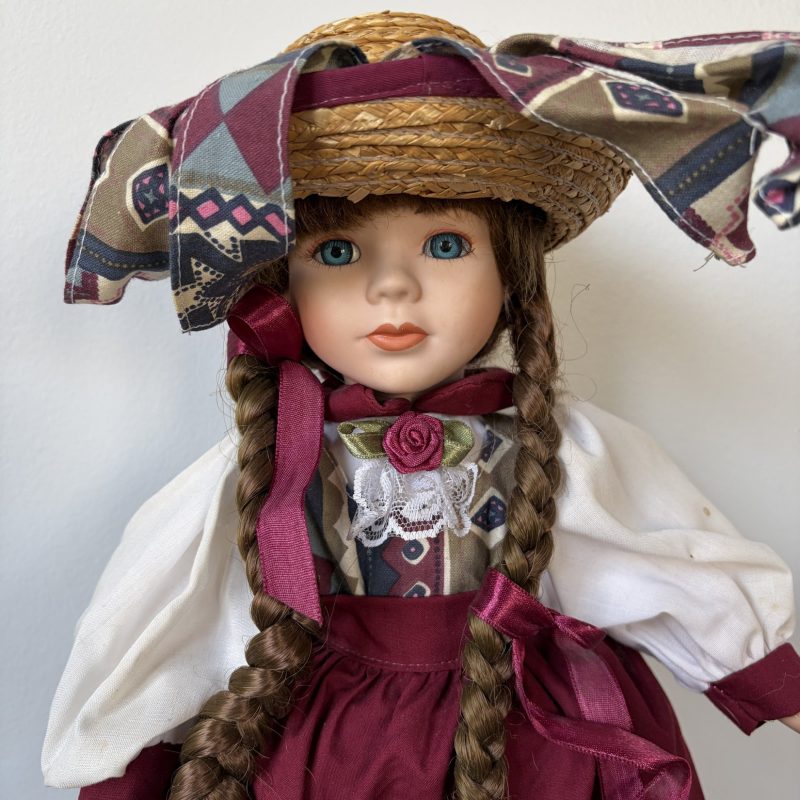 Heritage Mint Porcelain Doll with Braided Hair and Hat