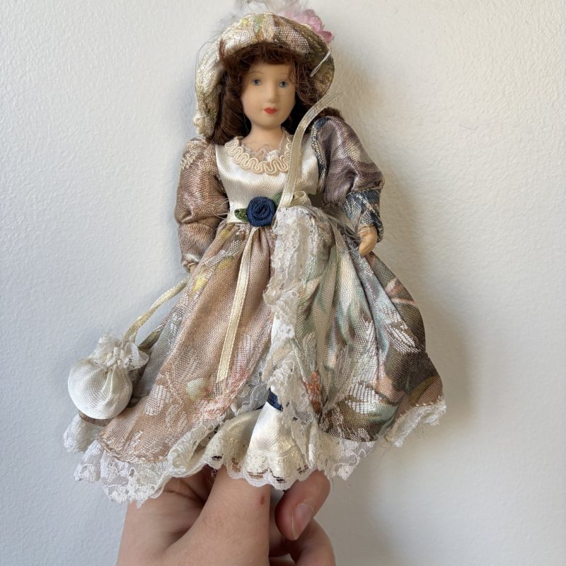 Vintage Porcelain Doll Collection in Victorian Dresses with Lace and Hats