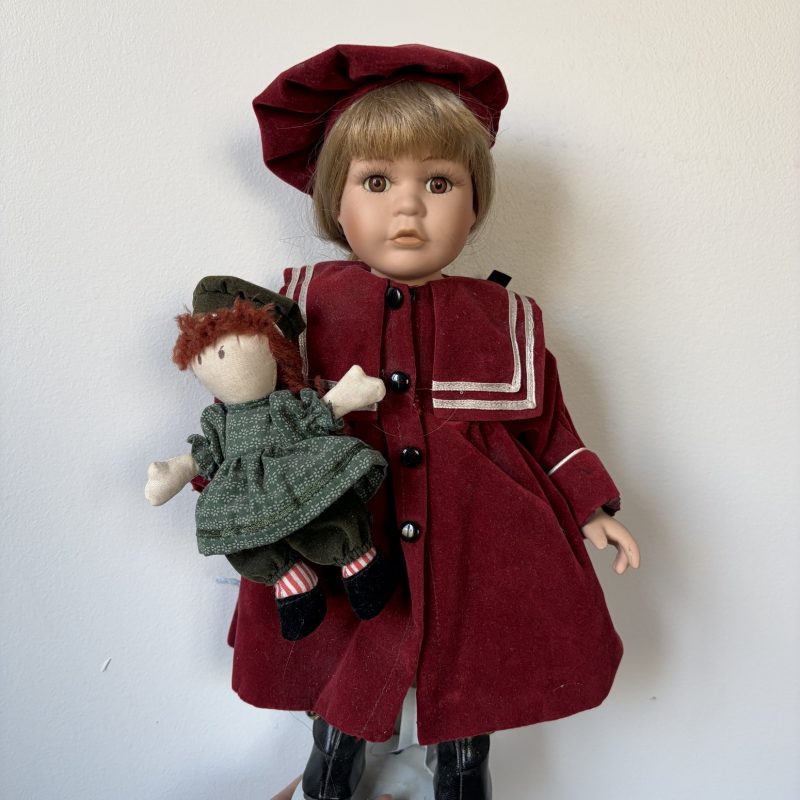 Porcelain Doll in Burgundy Outfit with Doll Accessory