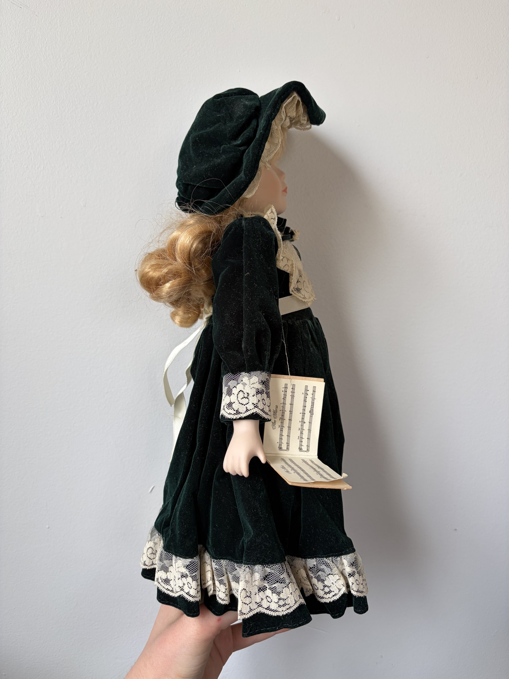 Ave Maria Porcelain Doll with Green Velvet Dress and Lace Trim - Image 3