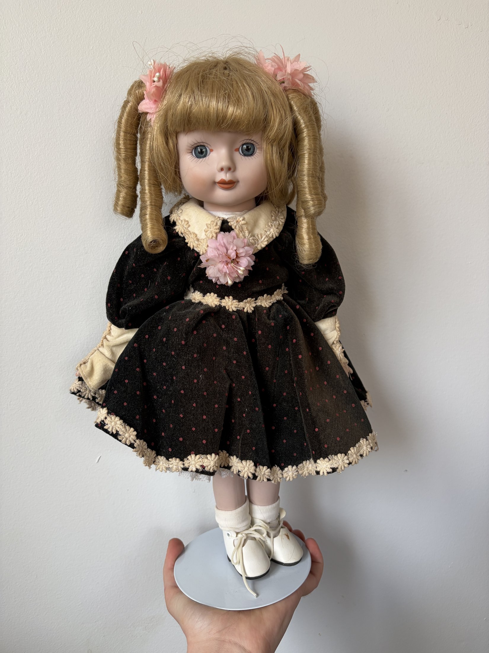 Vintage Porcelain Doll with Blonde Curls and Black Dress - Image 2