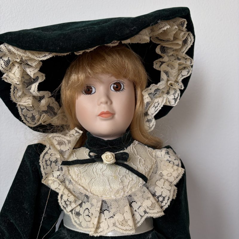 Ave Maria Porcelain Doll with Green Velvet Dress and Lace Trim