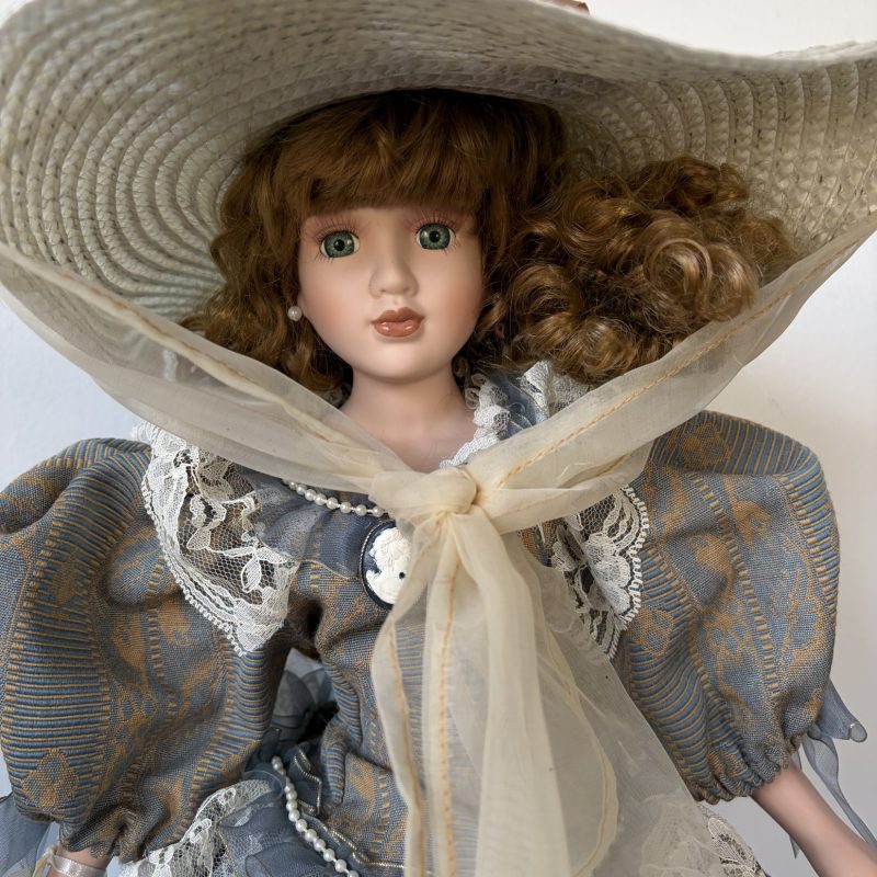 Porcelain Doll with Hat and Lace Dress