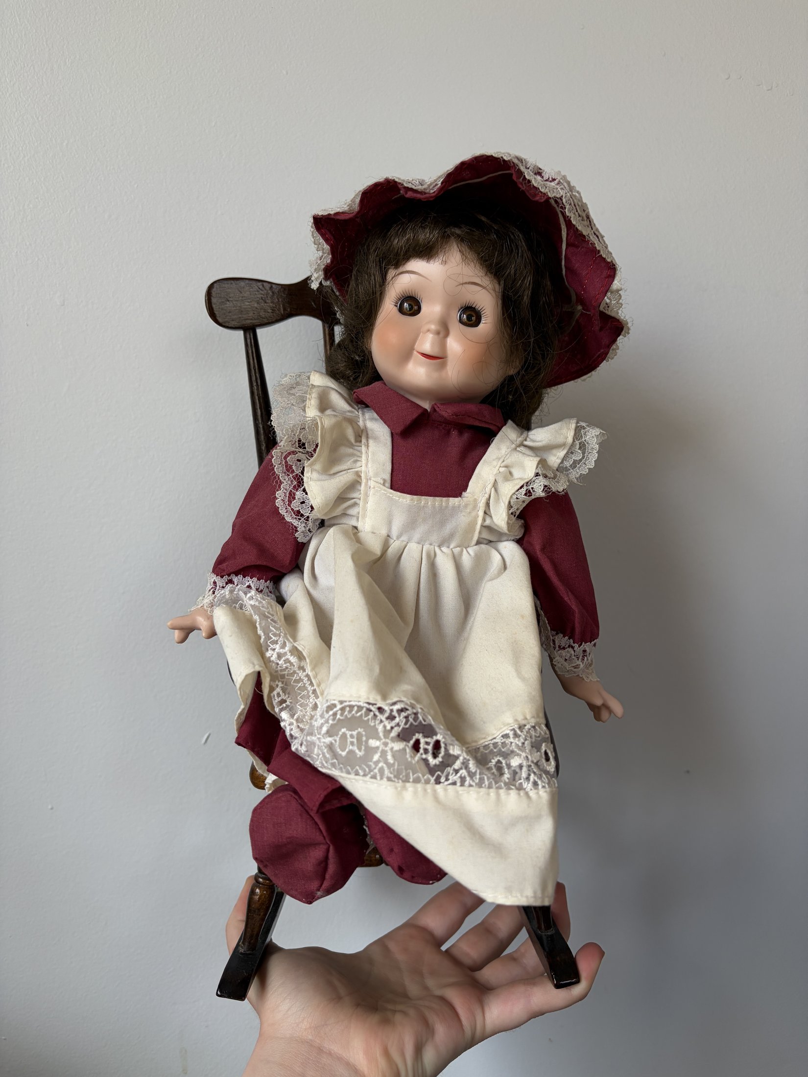 Vintage Porcelain Doll in Maroon Dress with Lace Trim - Image 2
